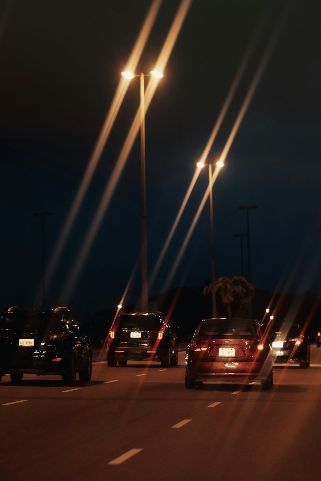 Cars on an Abuja road at night